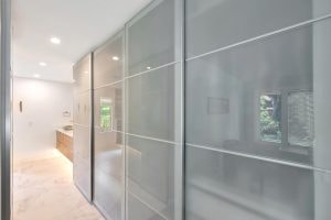 Reimagined closet – modern sliding glass doors