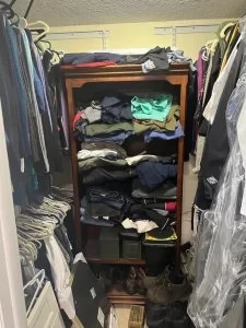 Closet before – overflowing wardrobe shelving