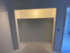 Closet before – empty bare shelving